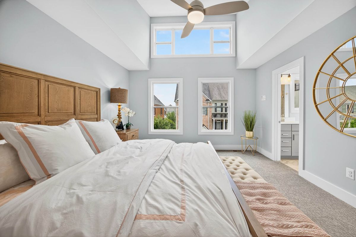 Interior real estate photography  -  bright vaulted bedroom