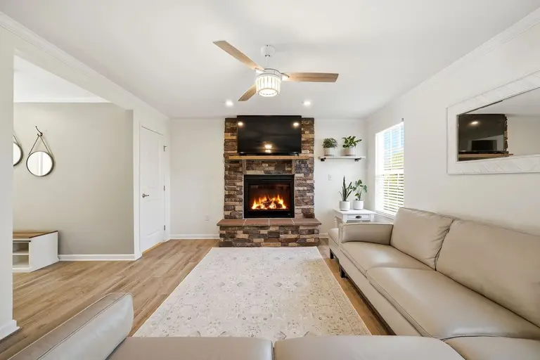 Interior real estate photography  -  living room with stone fireplace