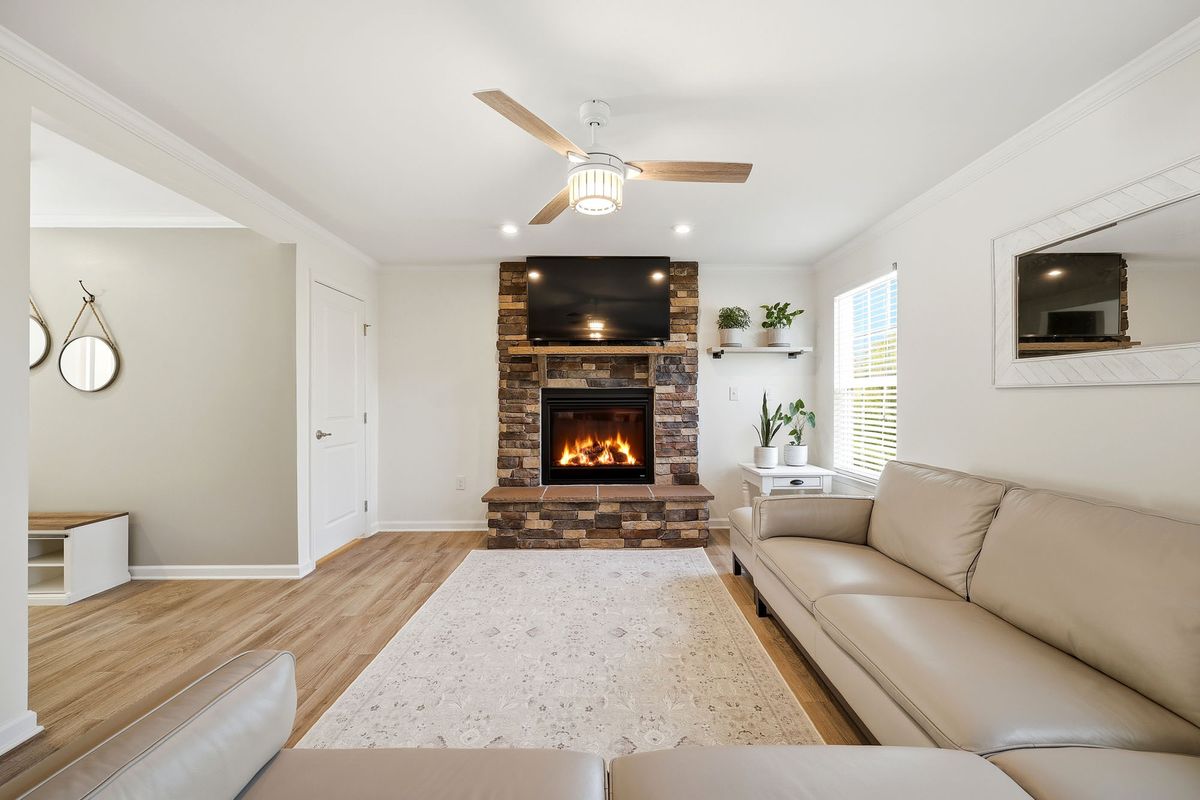 Interior real estate photography  -  living room with stone fireplace