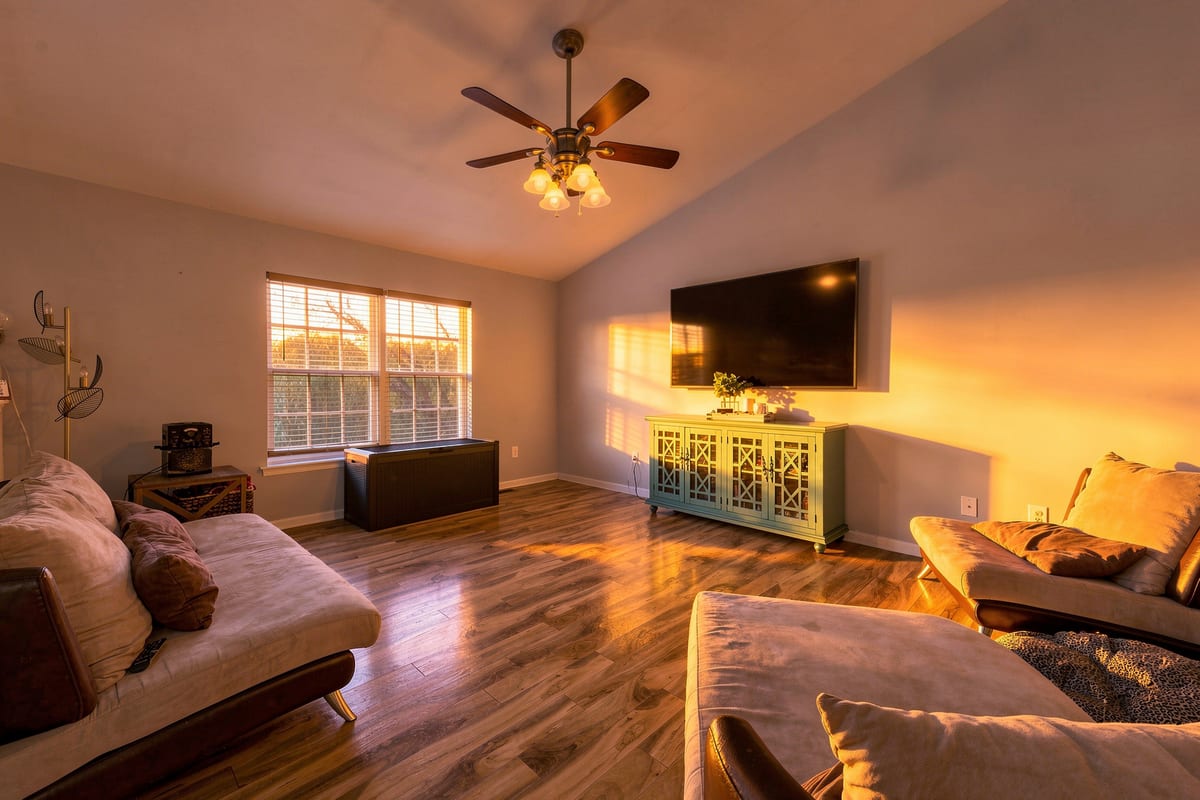 A living room finished with the Golden Hour treatment, warm light across the floor and walls